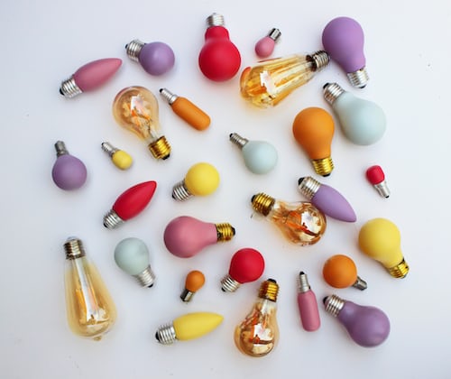 An array of different types of lightbulbs against a white backdrop