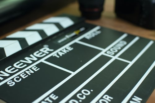 A black filming clapperboard