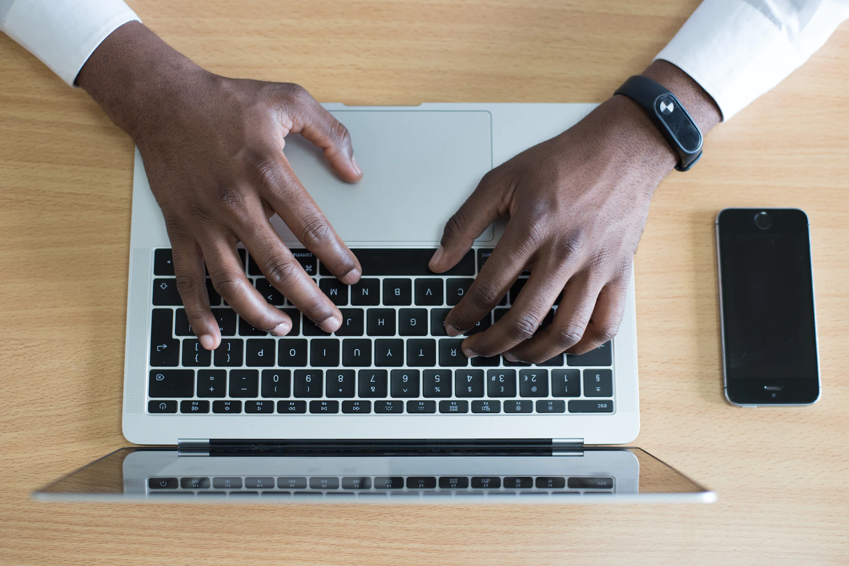 A virtual salesperson typing on their laptop